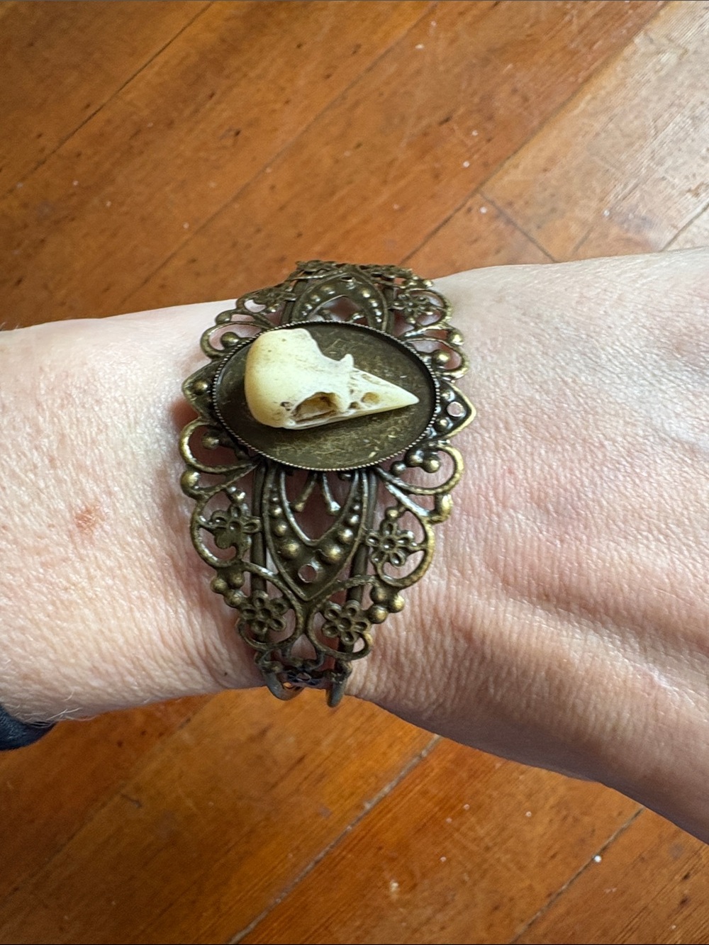 Hand-Crafted Antique Brass Filigree Bracelet with Ivory Bird Skull Accent